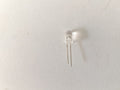 Clear LED bulb on a light gray background