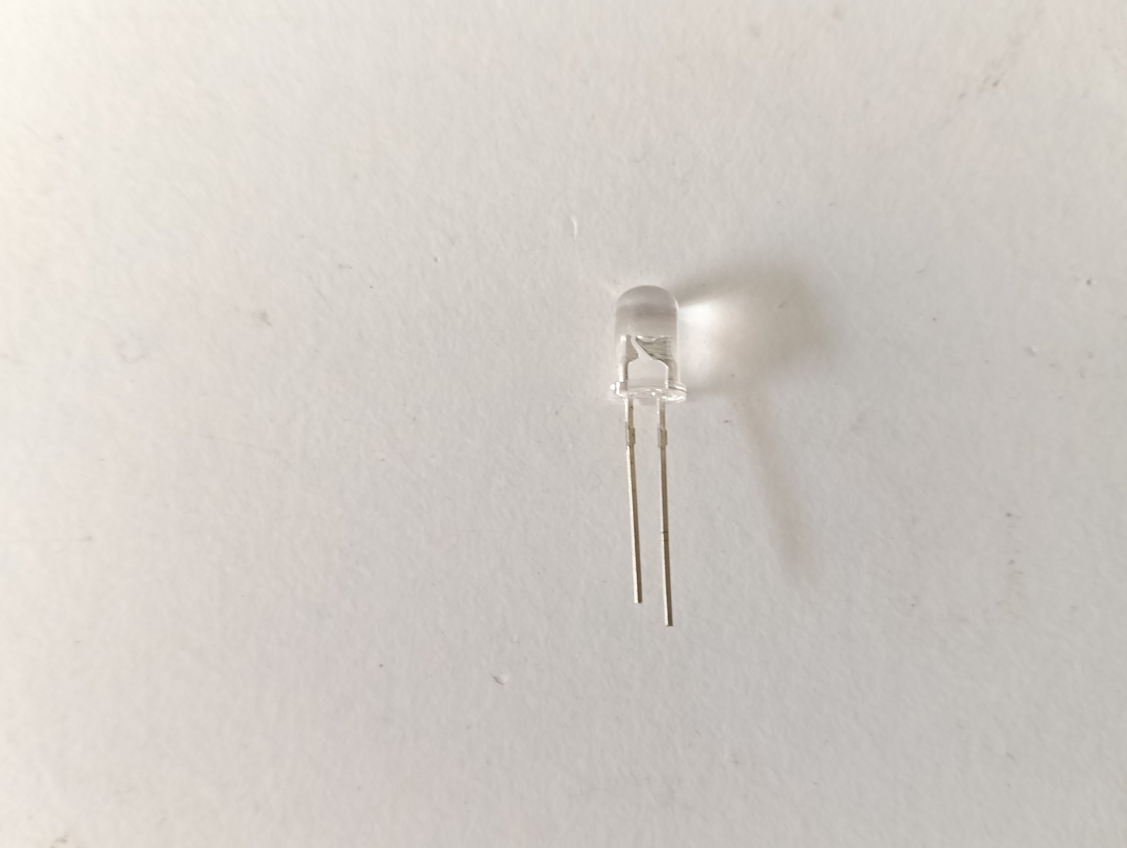 Clear LED bulb on a light gray background